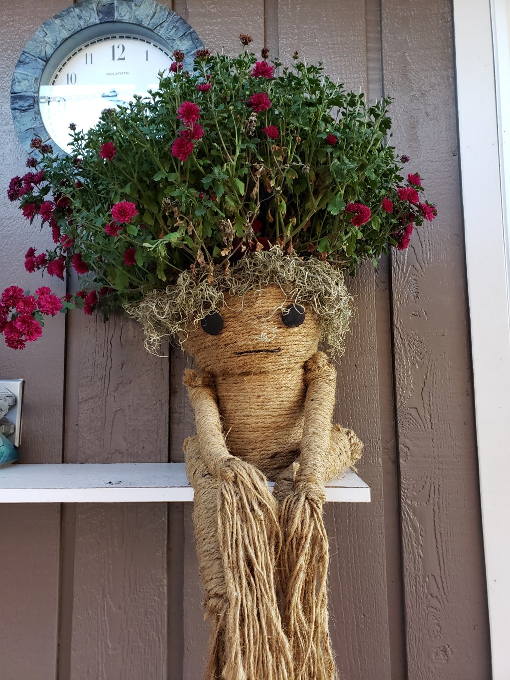 Twine creature with a flowering plant for hair