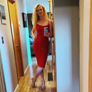Author dressed in red dress